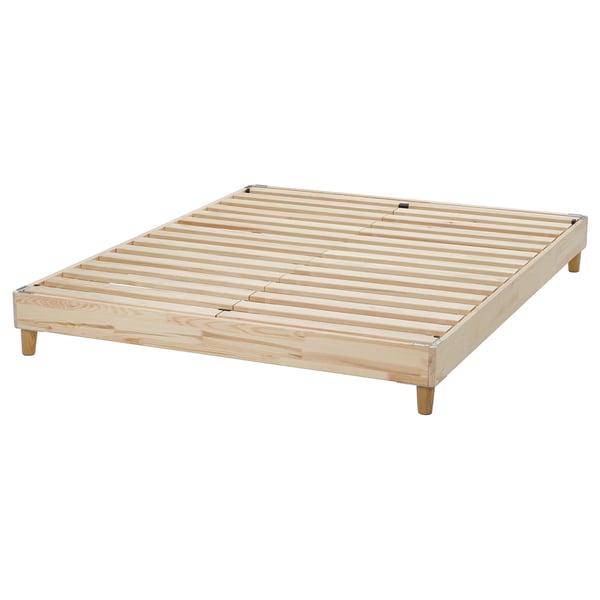 LEJDEBERGEN, a wooden bed base in natural colour. It’s made of solid pine, easy to assemble, and has a rectangular shape with four legs.