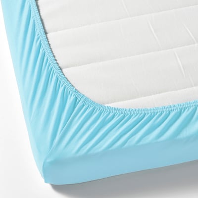 A fitted sheet in light blue with elastic edges, designed to keep it securely on a mattress. Perfect for a childs bed, made from breathable cotton.