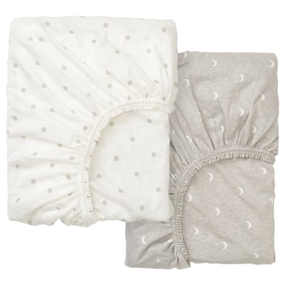 Two light-colored fitted sheets with dot patterns, one white and one gray, folded neatly.