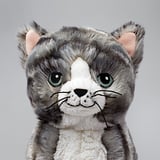 Soft gray kitten stuffed animal, big eyes, friendly face, made of polyester.