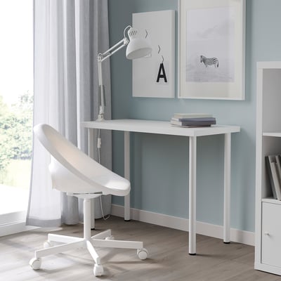 Modern white LINNMON desk in cozy room, minimalist, space-saving.