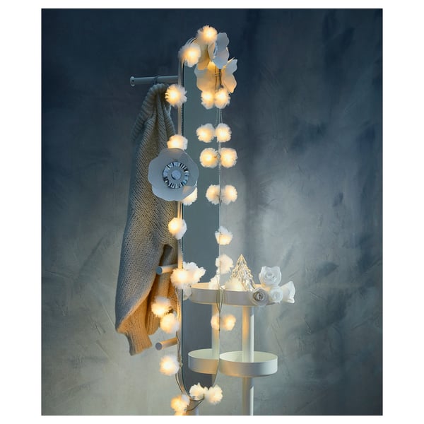 Decorative lighting: LIVSÅR, white, with soft pom-poms, hangs with warm light, modern home decor.