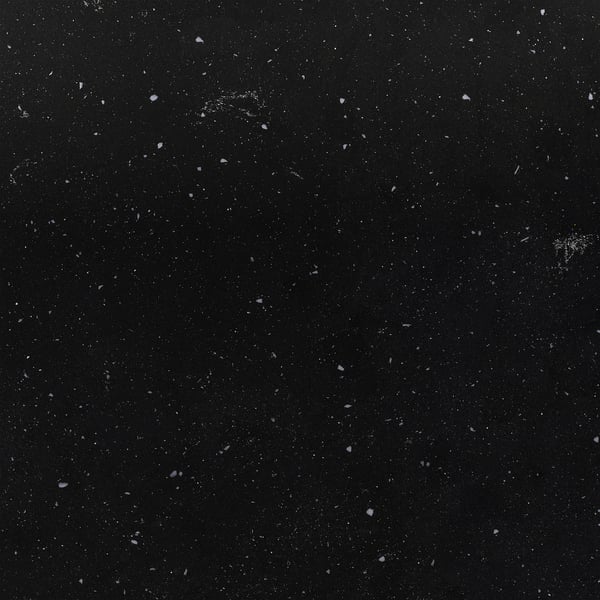Dark, speckled surface with scattered, tiny white flecks, representing a high-quality, recycled glass worktop.