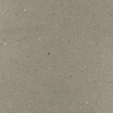 Greyscale speckled texture of recycled glass worktop.