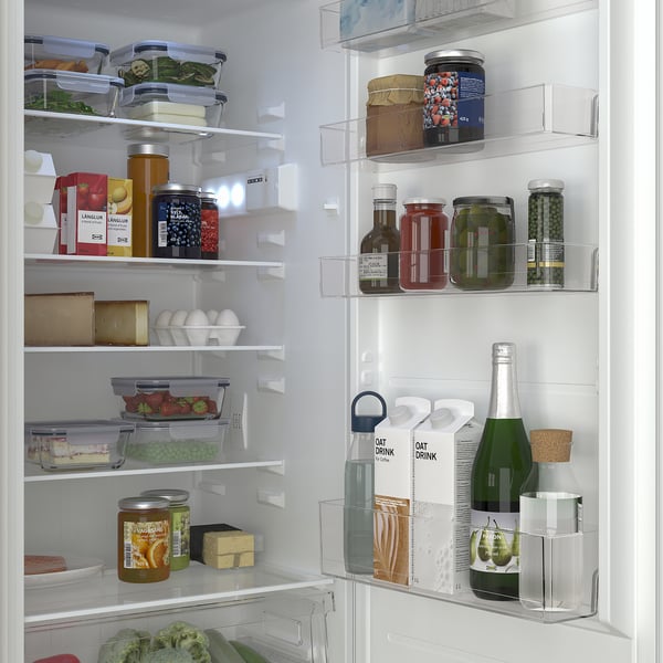 Fridge with adjustable shelves, organized food items, and led light inside, showing clean and neat storage.