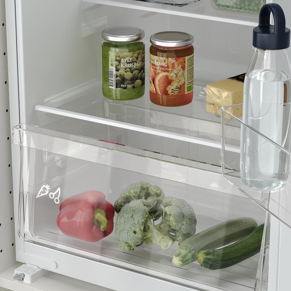 Fridge with adjustable glass shelves showing vegetables, water bottle, and jars; led lighting visible.