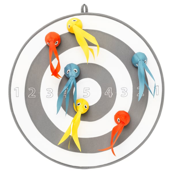 A colorful dart game target with plush octopus toys. It a circular gray design with numbered sections and playful toy darts in orange and blue.