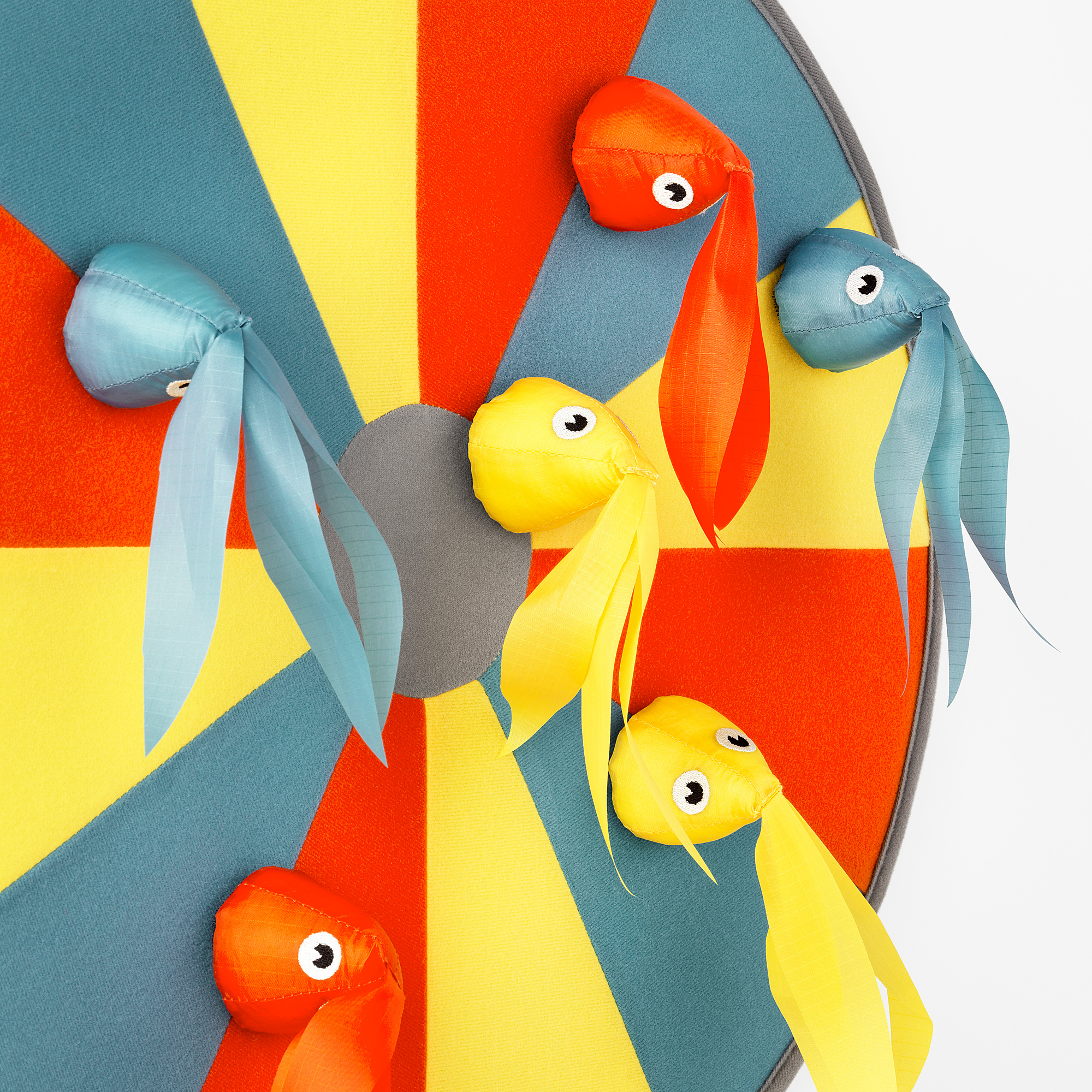 Circular dart game with colorful fish; high-quality recycled materials.