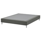 The LYNGÖR gray bed base a modern, low-profile design with a sturdy frame, metal legs, and a removable, washable fabric cover.