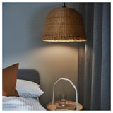 Hanging pendant lamp MÄVINN above bedside table with book, glass, and light.