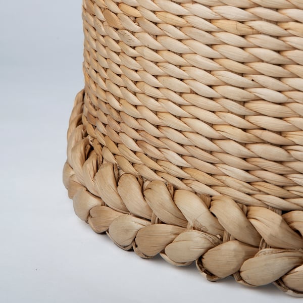 Handwoven lamp shade with intricate braiding, showcasing natural banana fibers, craftsmanship, and texture.