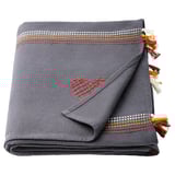 Grey embroidered cotton throw with red heart, tassels, and geometric border.