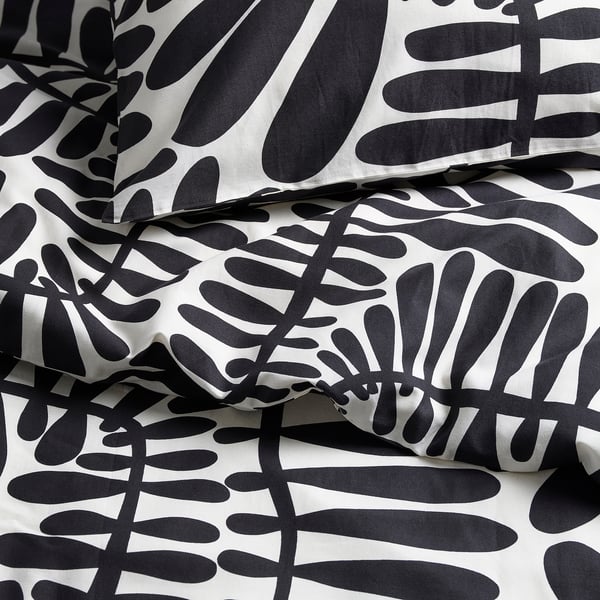 Black and white leaf-patterned bedding, crisp and stylish. 100% cotton blend, bold natural design.