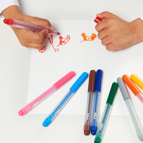 Children drawing with colorful MÅLA felt-tip pens on paper, showcasing creativity and artistic fun.