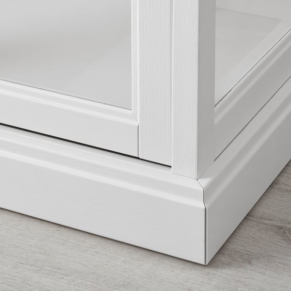 A sleek white wooden cabinet, showcasing fine craftsmanship with smooth edges and integrated dampers for silent closing.