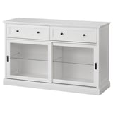 A white MALSJÖ cabinet with two drawers and two glass doors, designed with a classic aesthetic.