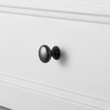 A close-up of a white drawer with a sleek black handle, showcasing high-quality design and finish.