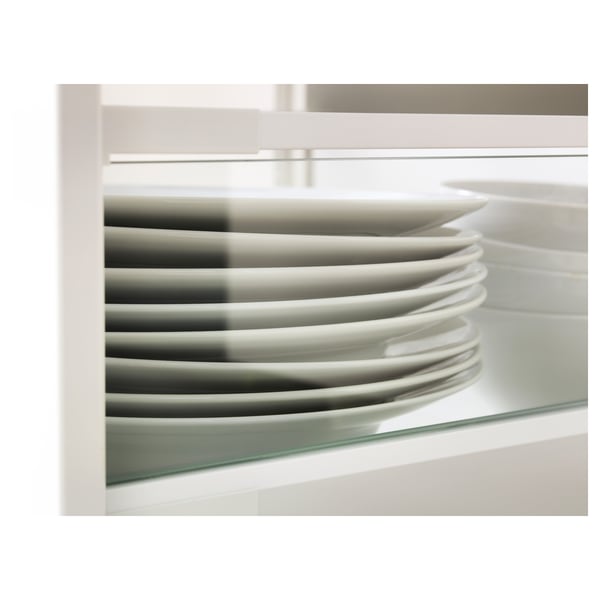 Stacked white plates inside a glass-sided drawer, showcasing organizational clarity and preventing items from sticking out.