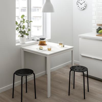 MELLTORP white table with black stools, plant, clock, teapot, cake, cozy.