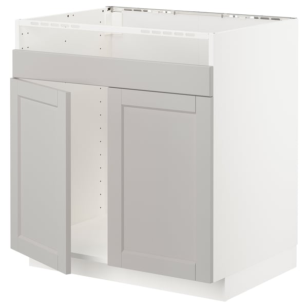 A white METOD kitchen cabinet with light grey lerhyttan doors featuring beveled edges and a traditional design.