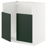 A white METOD kitchen cabinet with deep green doors, featuring a sturdy frame and snap-on hinges.