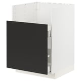 A modern kitchen cabinet in white with a black door.