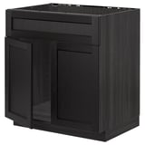 Black kitchen cabinet with shrimp-shaped design and dark stained wood finish.