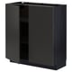 A black METOD kitchen cabinet with one open door, revealing an empty shelf. It has a sleek, modern design.