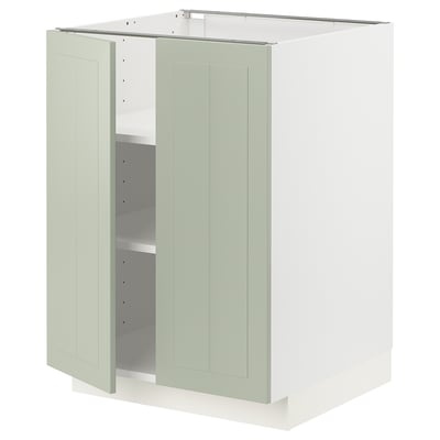 Green METOD kitchen cabinet with adjustable shelves and reversible door.