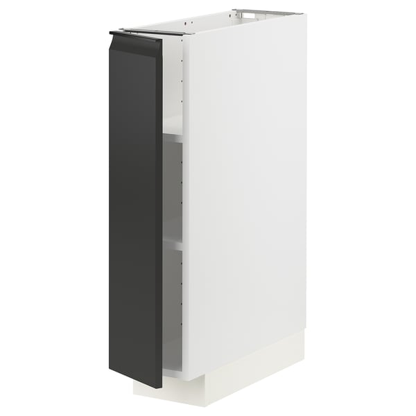 A white METOD kitchen cabinet with a matte black door and integrated handle. The cabinet is rectangular with adjustable shelves.