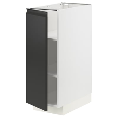 A modern, white METOD kitchen cabinet with a black matte door, featuring a sleek handle.