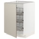 METOD kitchen cabinet in beige with pull-out wire baskets for pots and pans.