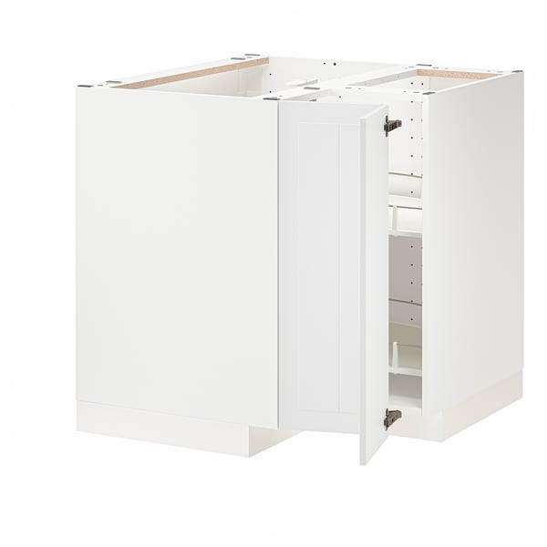 White METOD kitchen cabinet set with one door open, showcasing internal shelves.