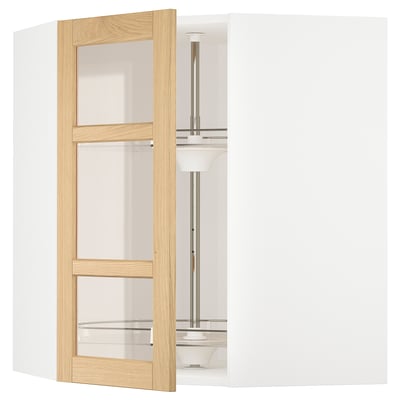 Modern kitchen unit with light oak doors, glass shelves, stainless metal rail, clean design.