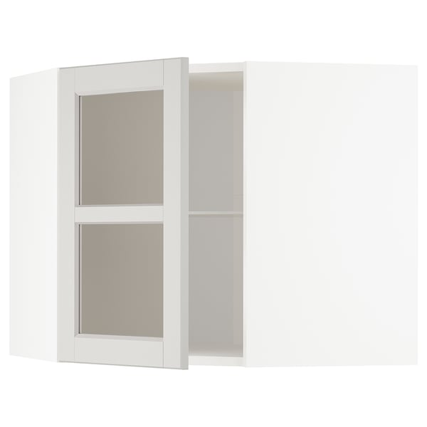 White METOD kitchen cabinet, light grey glass doors with beveled edges, adjustable shelves.