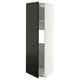 A white and black METOD kitchen cabinet with a sleek, modern design and a single door.
