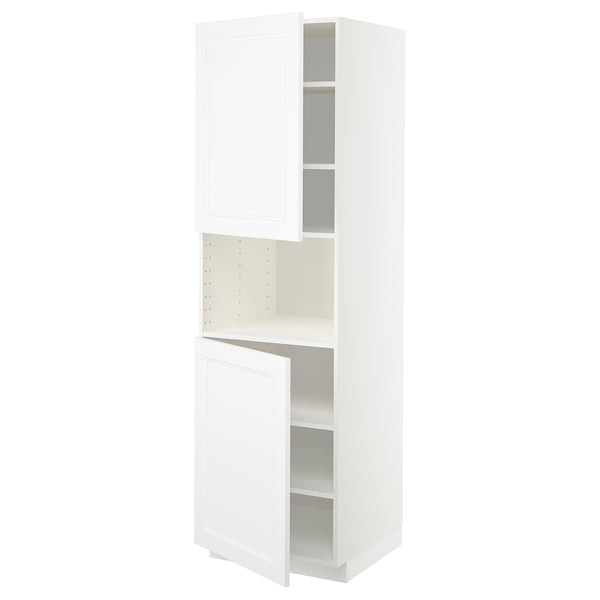 A white METOD kitchen cabinet with one door open, revealing adjustable shelves.