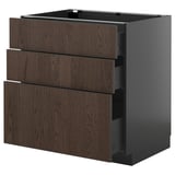 An ultra-modern dark brown wood and black kitchen cabinet set with multiple drawers.