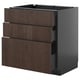 An ultra-modern dark brown wood and black kitchen cabinet set with multiple drawers.