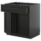 Black stained kitchen cabinet with open drawer, traditional design.