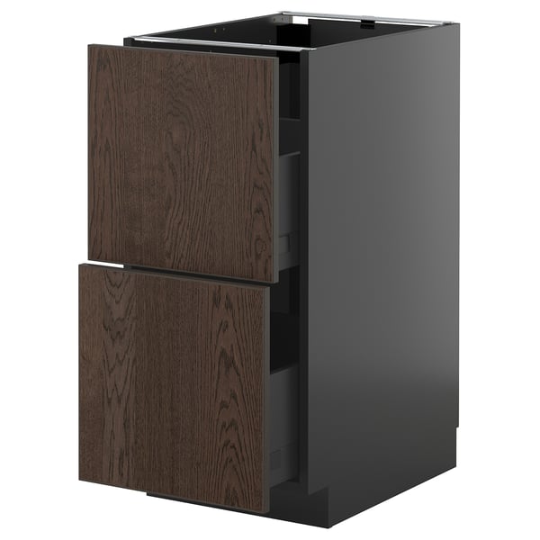 Dark brown kitchen cabinet, grey base, wooden handles.