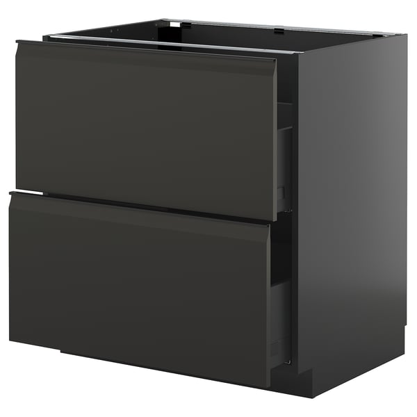 Modern black kitchen cabinet with sleek, handle-less drawers.
