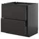 Modern black kitchen cabinet with sleek, handle-less drawers.