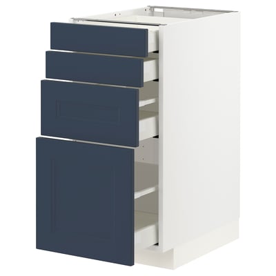A white METOD kitchen cabinet with blue axstad drawers. This modern design multiple drawers with a smooth, slow-close mechanism.