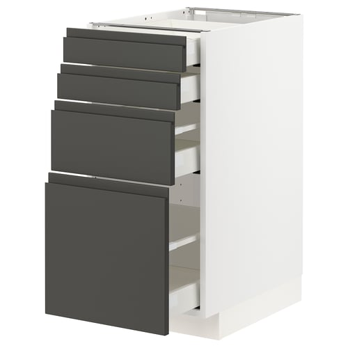 A METOD kitchen unit with dark grey voxtorp drawers and a white cabinet. It multiple drawers with integrated handles.