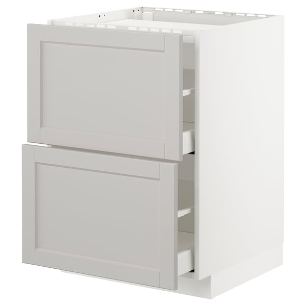 White METOD kitchen cabinet with beveled drawers and shelves.