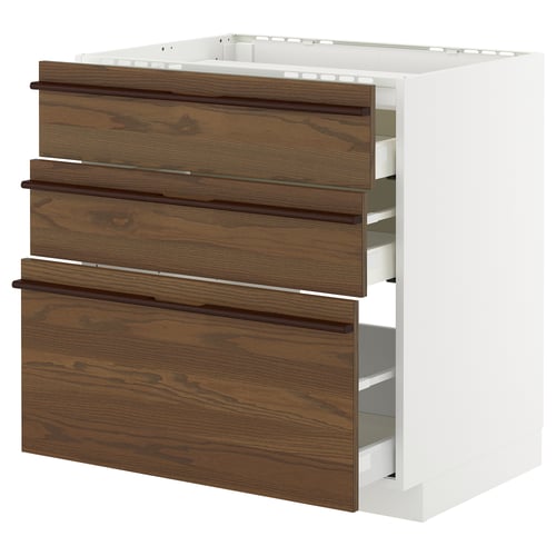 A white and dark brown stained ash veneer METOD kitchen cabinet with three drawers and solid wood handles.