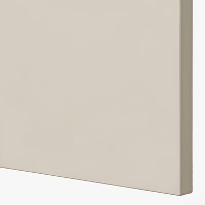Close-up of smooth, beige kitchen cabinet. Modern design and quality finish.
