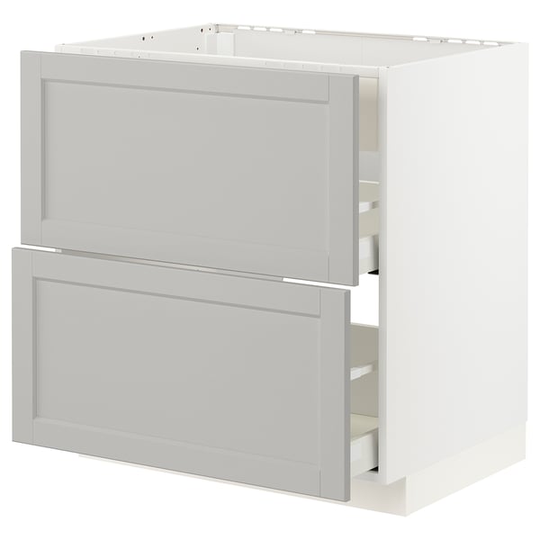 A white METOD kitchen cabinet with light grey lerhyttan drawers, featuring a classic design with bevelled edges.