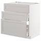White METOD kitchen unit. Three light grey drawers, bevelled edges. Modern, minimalist design.